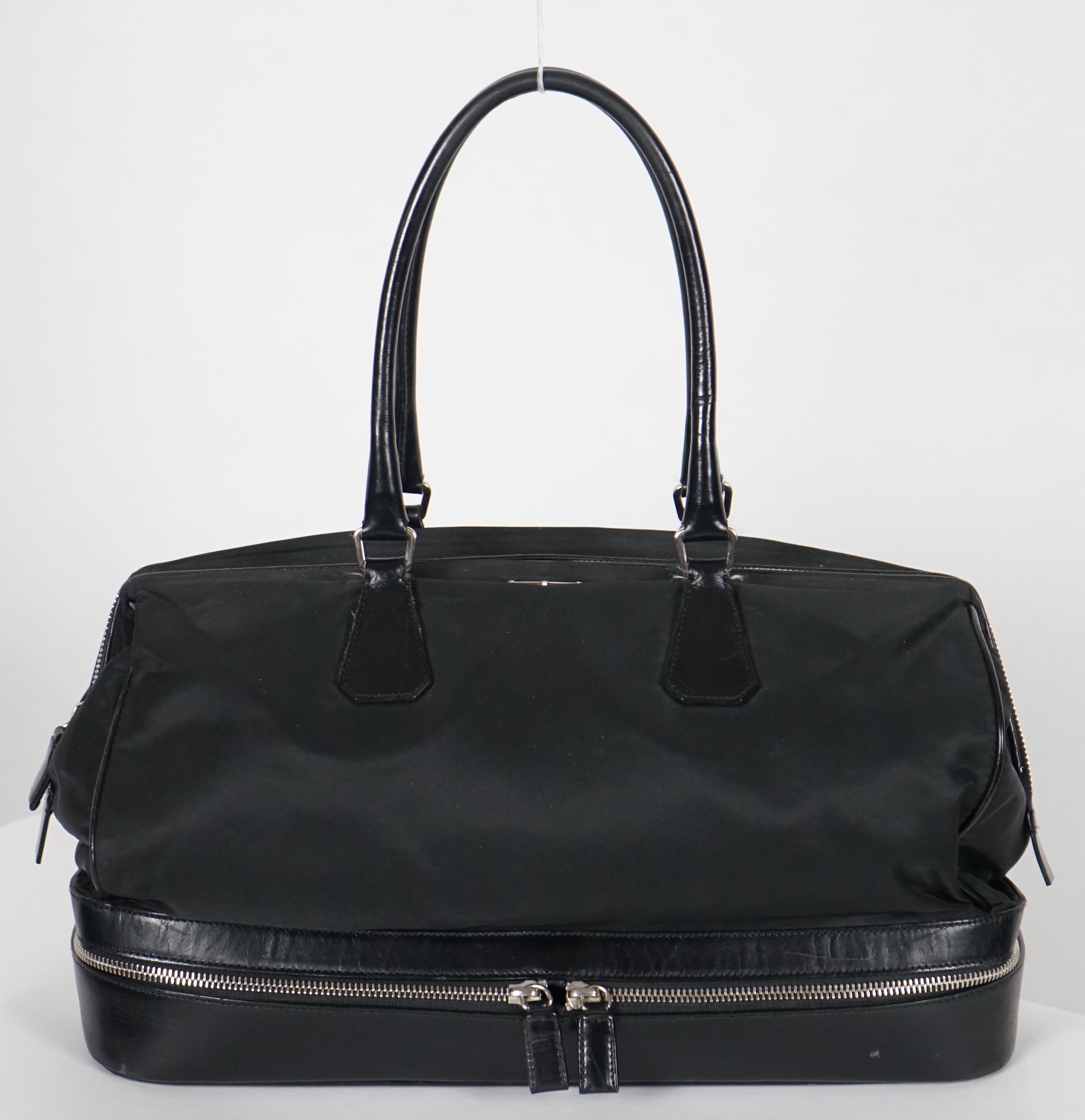 A Prada Tessuto black nylon and leather bag, width 38cm, height 23cm, depth 50cm